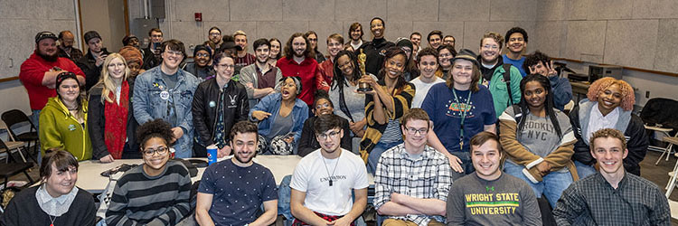 photo of students with alumna hannah beachler and her oscar