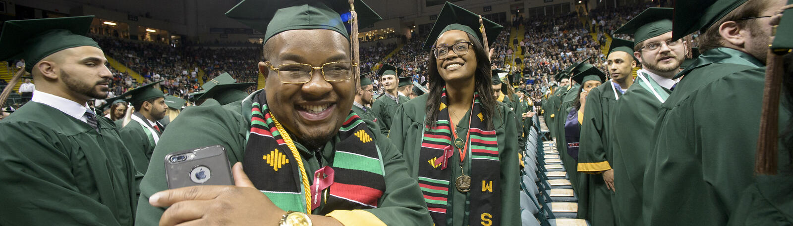 photo of happy graduates at a wright state commencement ceremony